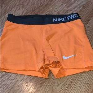 Orange Nike pros